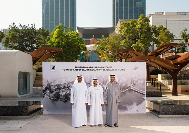 Mubadala and Aldar officials at the landmark JV signing.